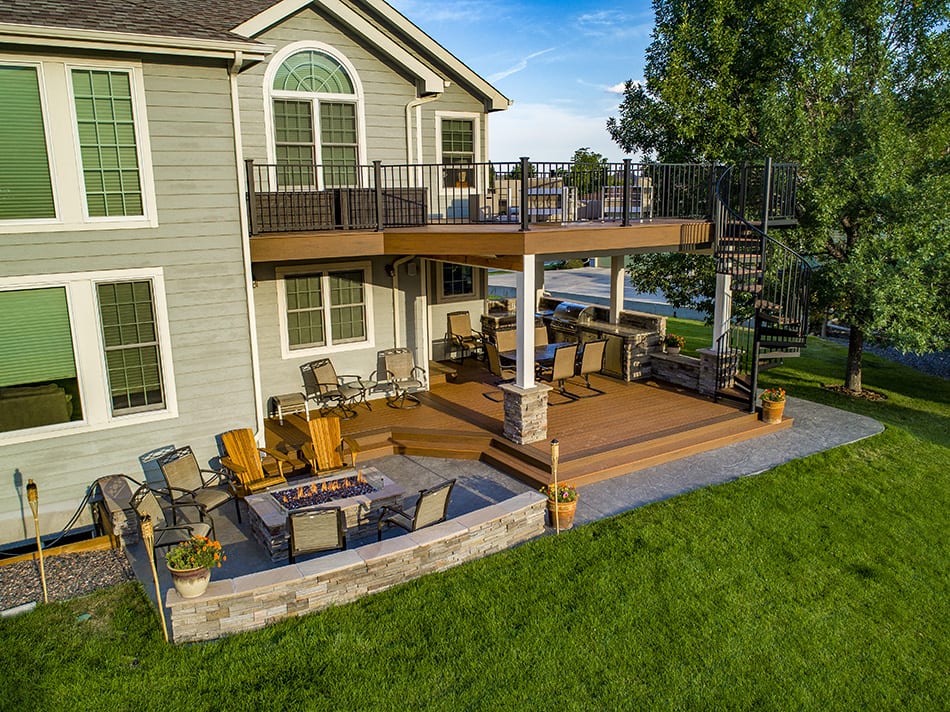 multi-level deck on tan house