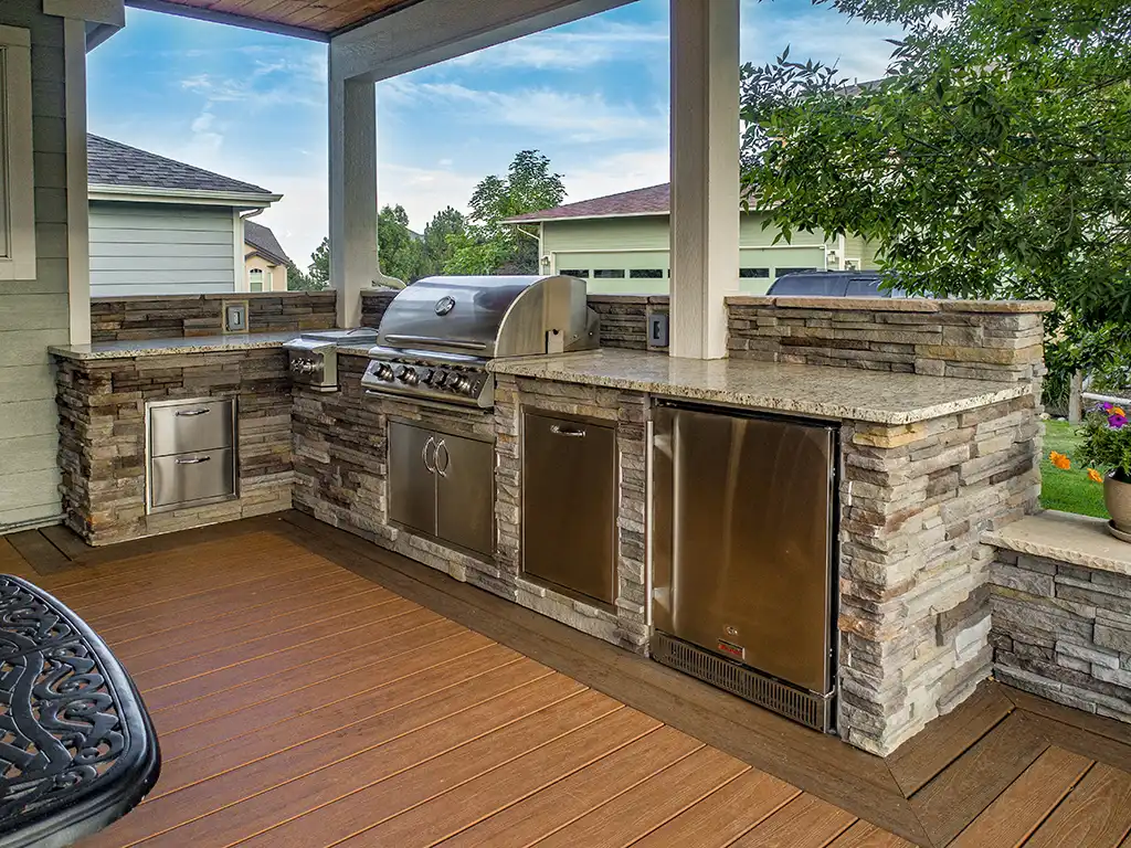 Photo of a covered deck with an outdoor kitchen