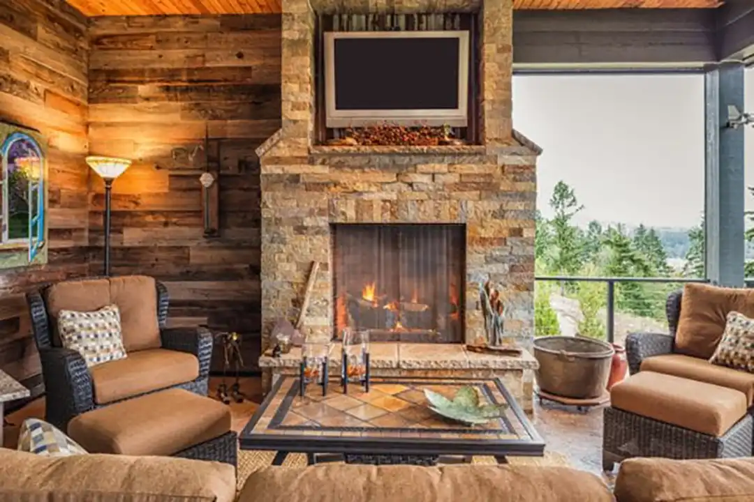Photo of a fireplace in an outdoor room.