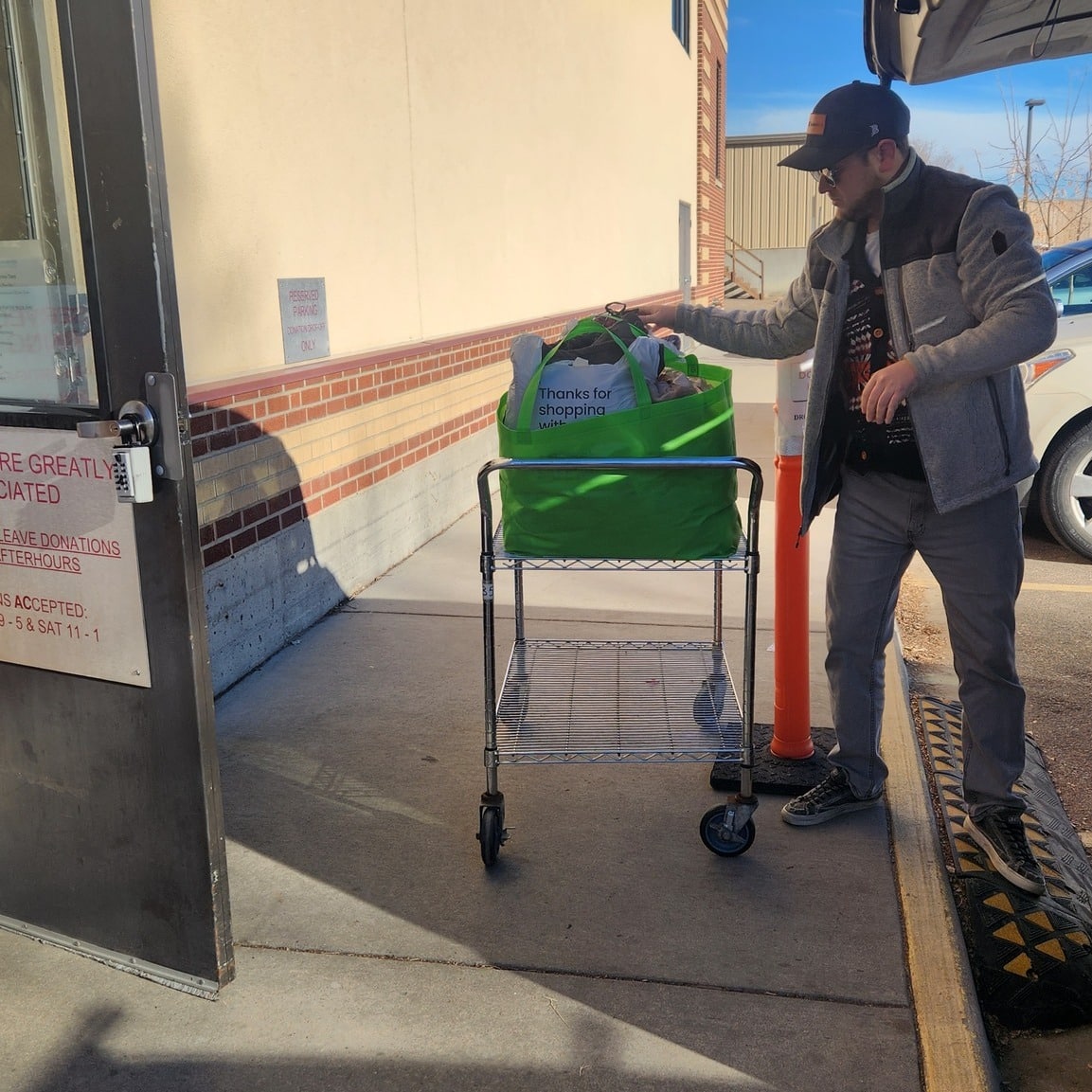 Derek dropping off donations