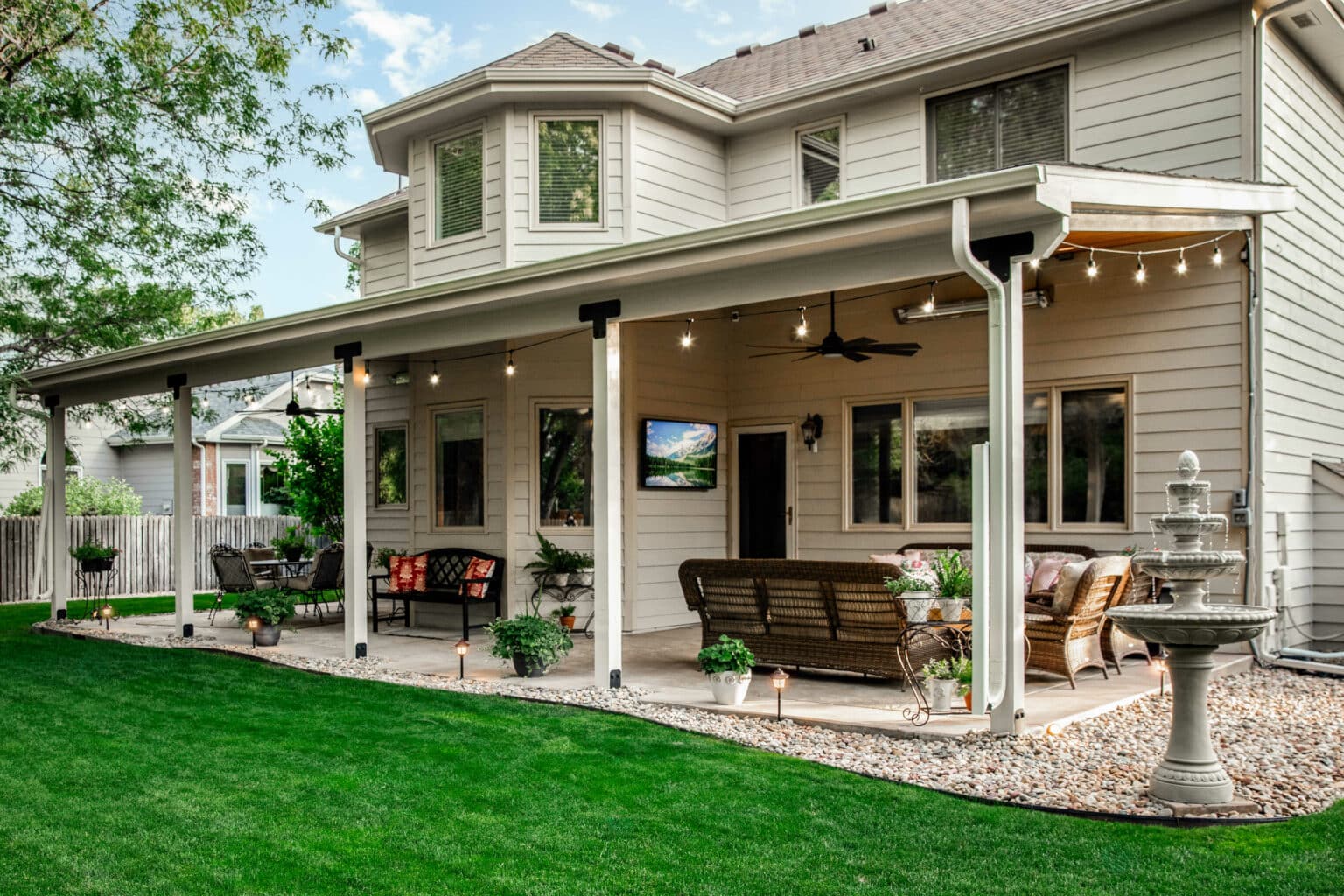 open patio that was remodeled to include a roof structure to convert it into a veranda.