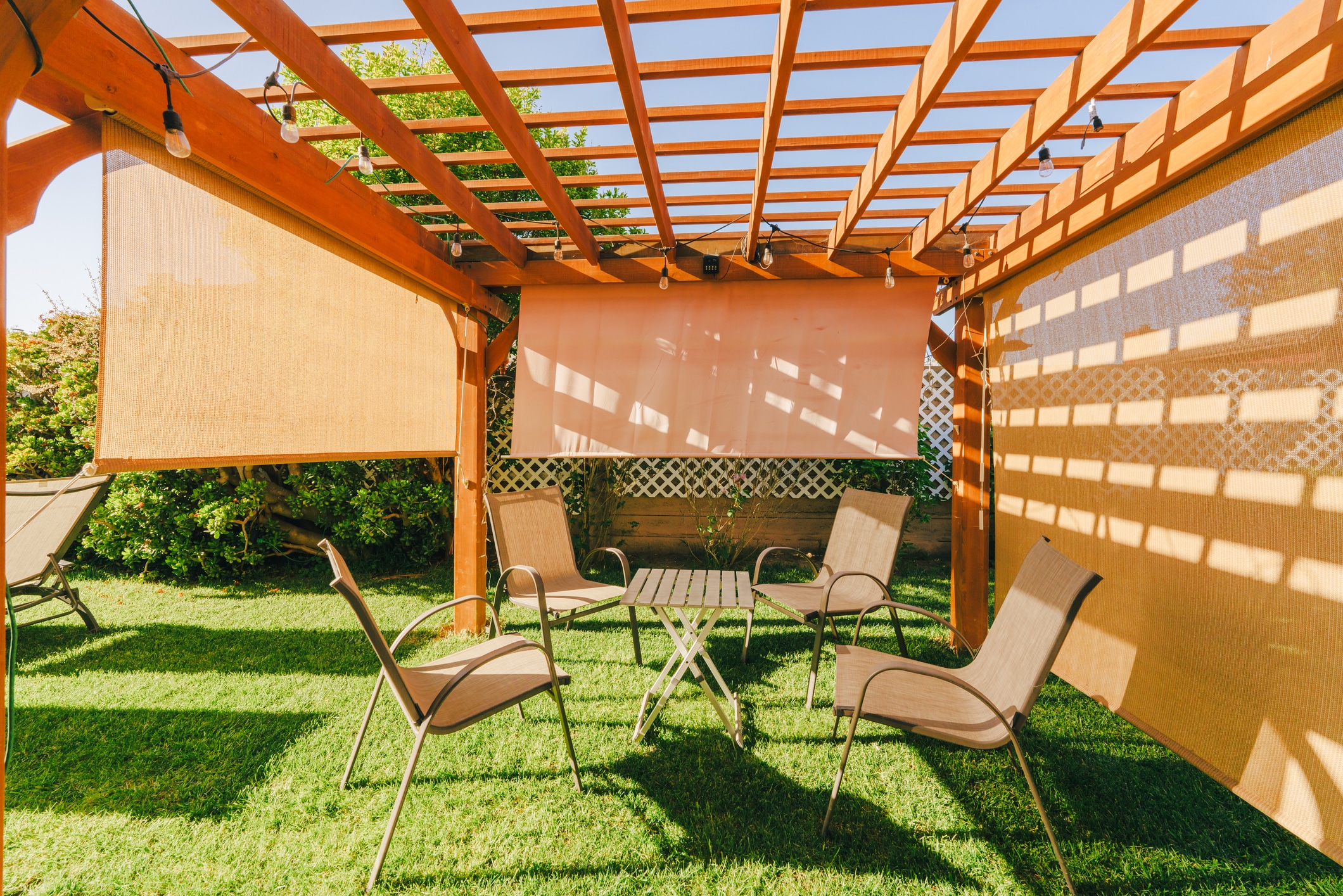 wooden pergola with shade curtains - Wood pergola Builders in Colorado