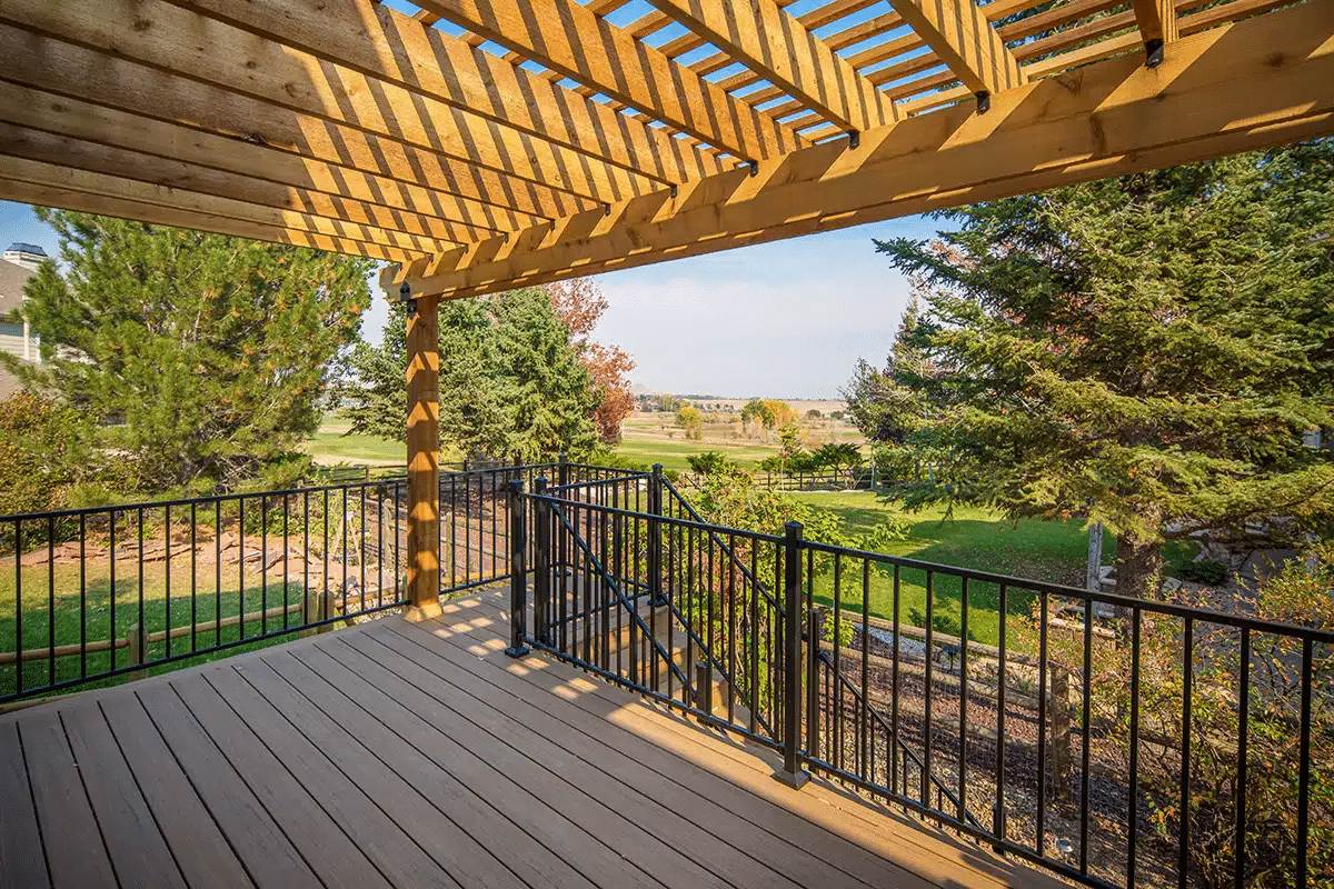 Best Materials for Off-Season Deck Building - composite deck with deck railing and a pergola