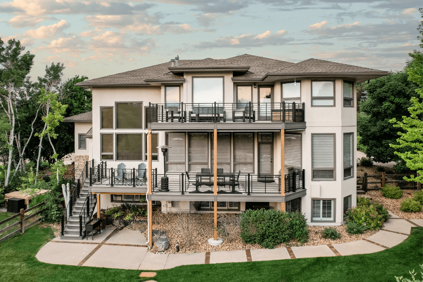 photo of a multi-level deck with cable railing and deck steps - Quality deck design services in Colorado