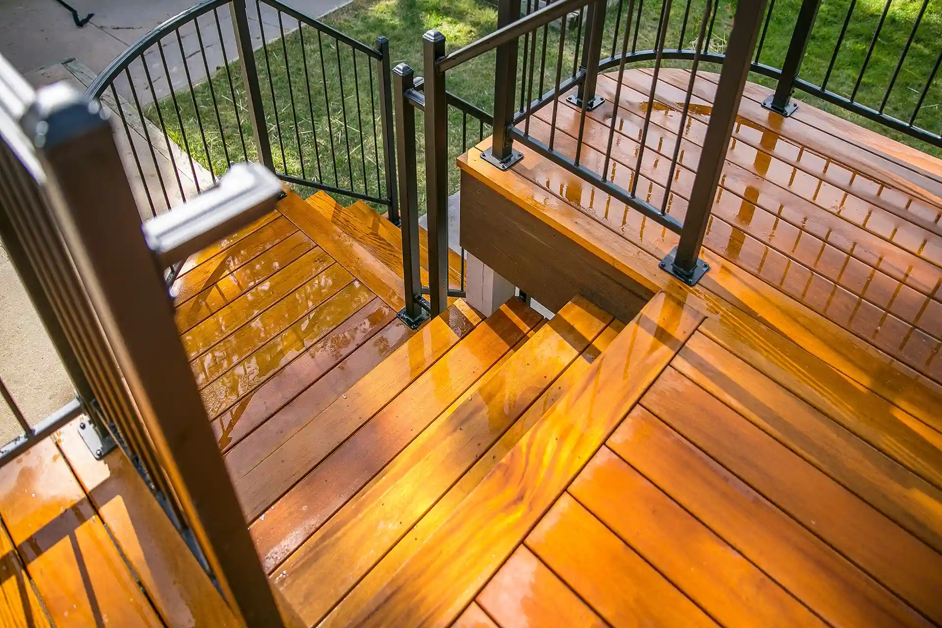 Multi-level deck with stairs and a covered lower patio.